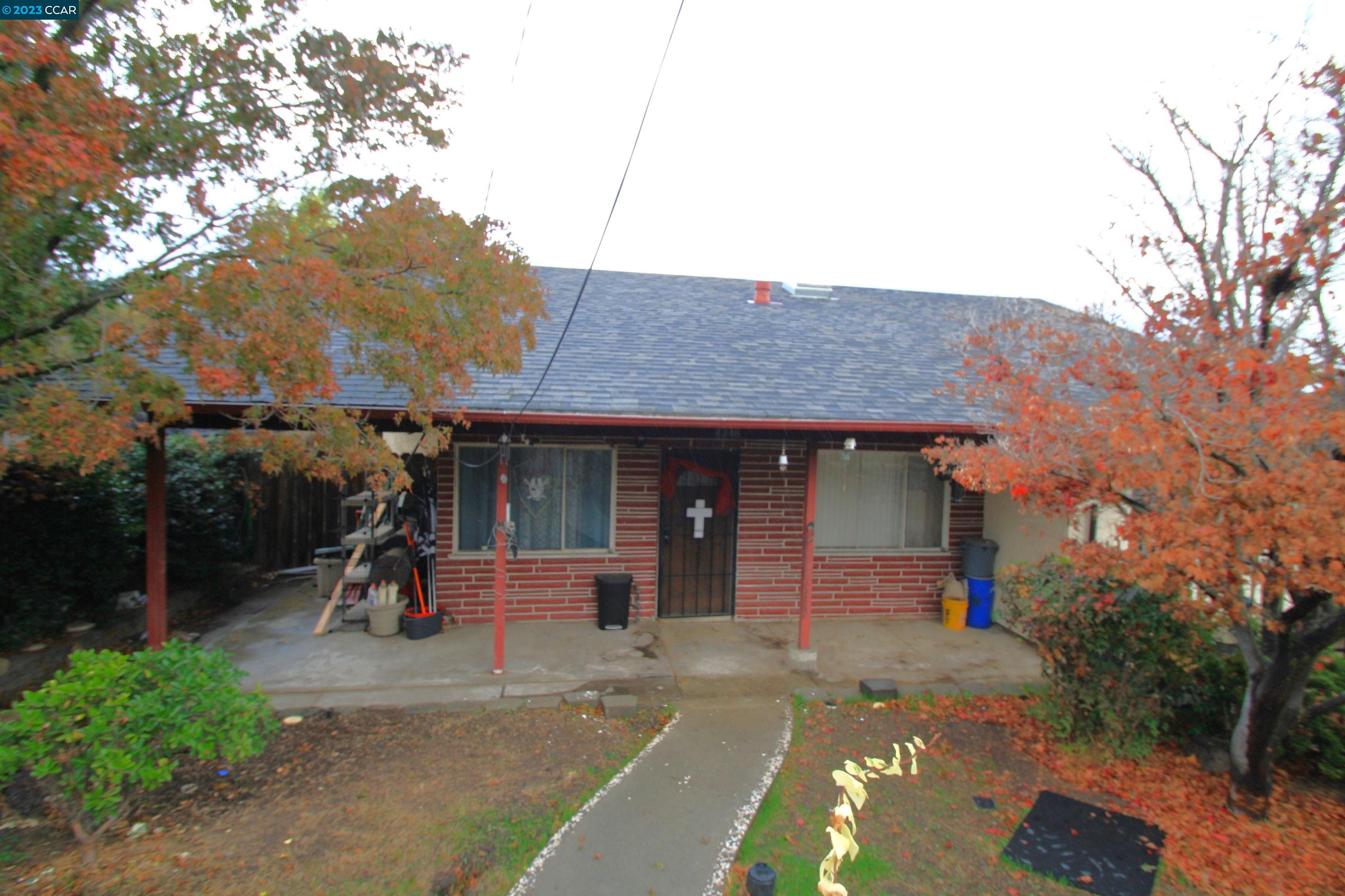 4346 Arthur Road Martinez, CA 94553 - Photo 1 of 1 a front view of a house with a garden