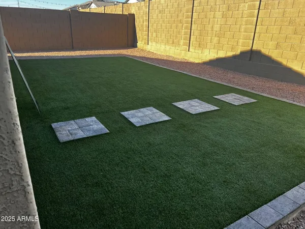 swimming pool view with a garden