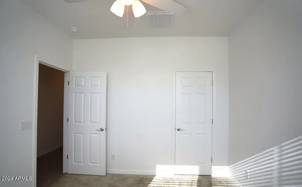 a bathroom with a sink shower and a mirror