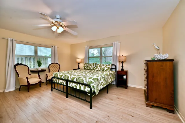 a bed room with furniture and wooden floor