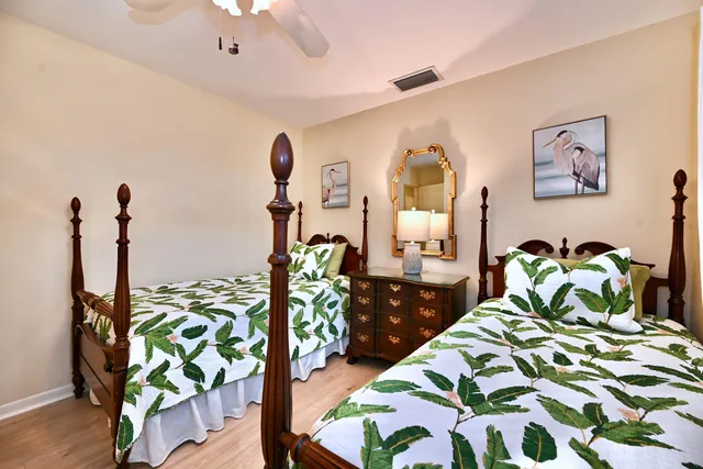 a bedroom with bed and a window