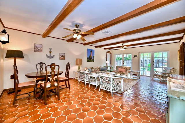 a living room with lots of furniture and white walls