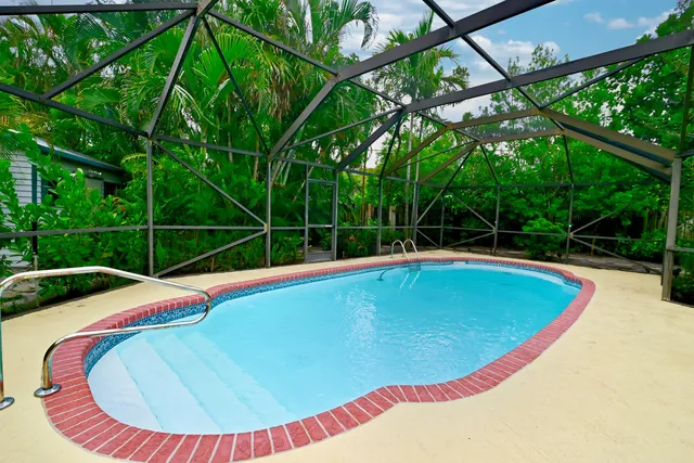 a view of a swimming pool with a lounge chair