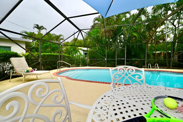 a view of a swimming pool with a patio