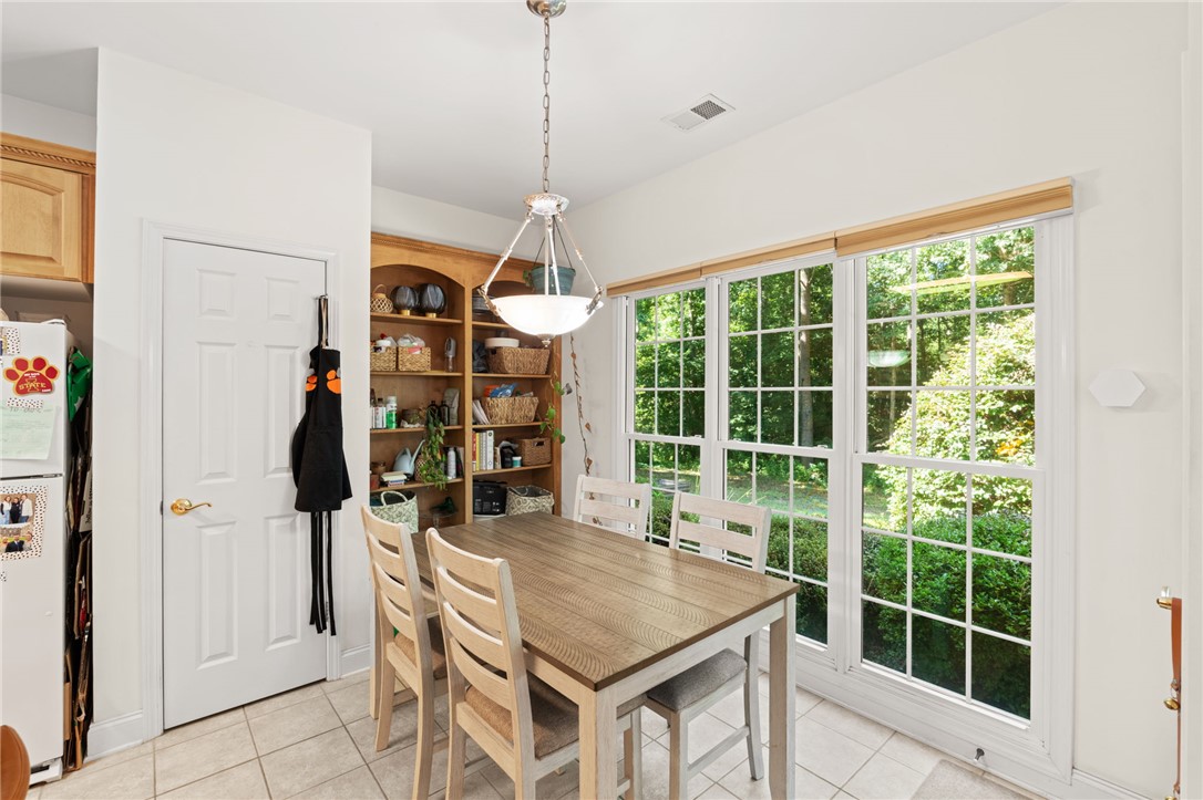 108 Winterbrook Circle Seneca, SC 29678 - Photo 14 of 40 Sun-filled breakfast area with built-in shelving and ample natural light.