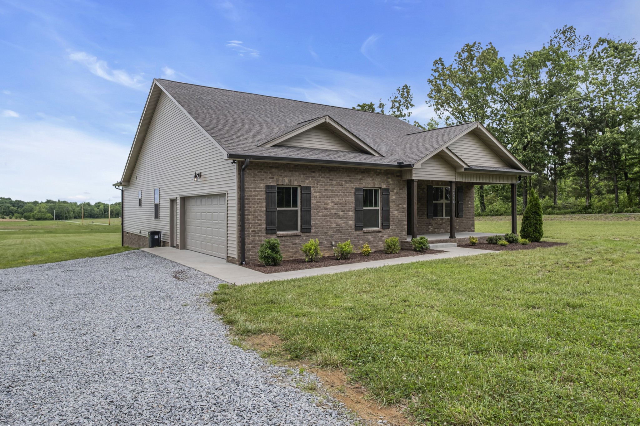 724 White Road Portland, TN 37148 - Photo 2 of 32 a front view of a house with garden