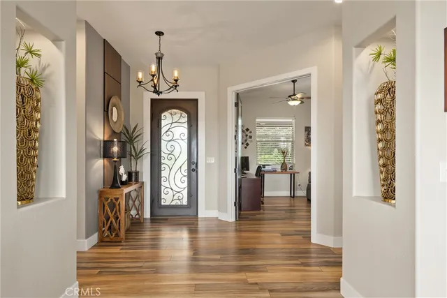 a view of a hallway view with wooden floor and staircase