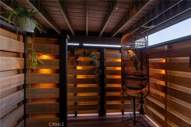 a view of a chair and table in backyard of the house
