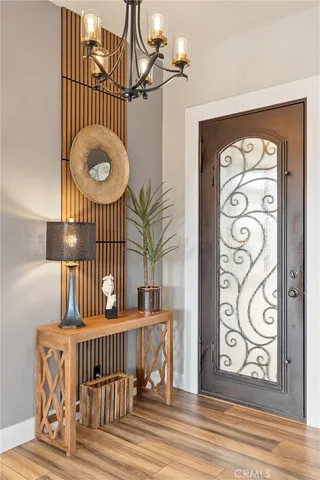 a living room with furniture a large window and a flat screen tv