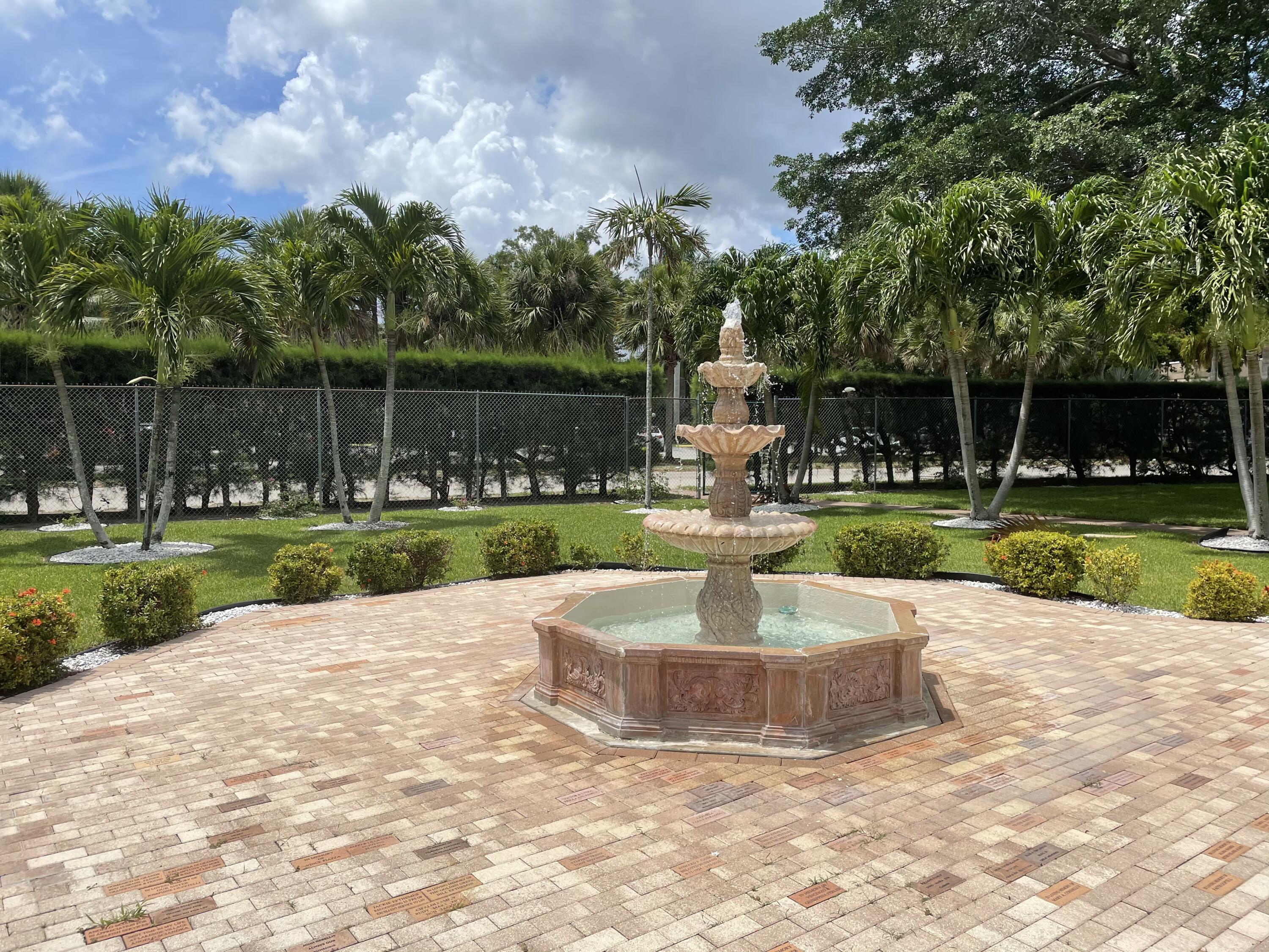 506 Davis Road, Unit 6 Palm Springs, FL 33461 - Photo 31 of 61 a view of a fountain with a yard