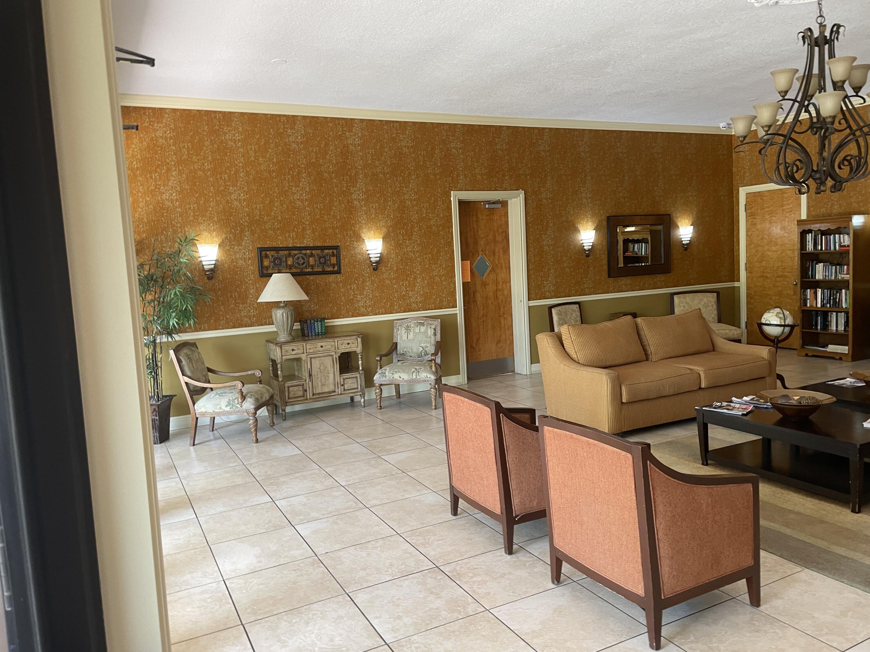 506 Davis Road, Unit 6 Palm Springs, FL 33461 - Photo 34 of 61 a living room with furniture and a lamp