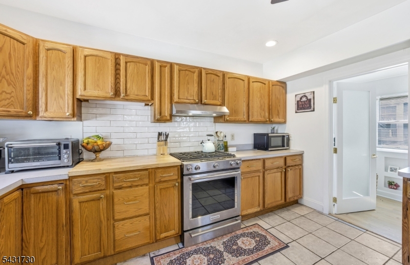 105 Main Street Lebanon, NJ 08833 - Photo 11 of 25 a kitchen with stainless steel appliances granite countertop a stove a sink and a cabinets