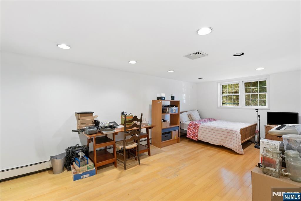 1675 Broad Street Bloomfield, NJ 07003 - Photo 20 of 35 a bedroom with furniture and a window