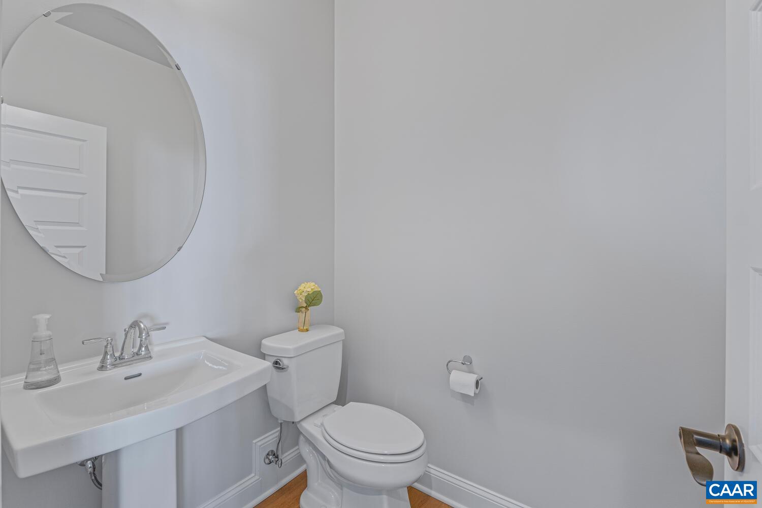 1731 Fowler Street Charlottesville, VA 22901 - Photo 22 of 45 a bathroom with a sink a toilet and a mirror