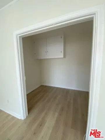 an empty room with a bench