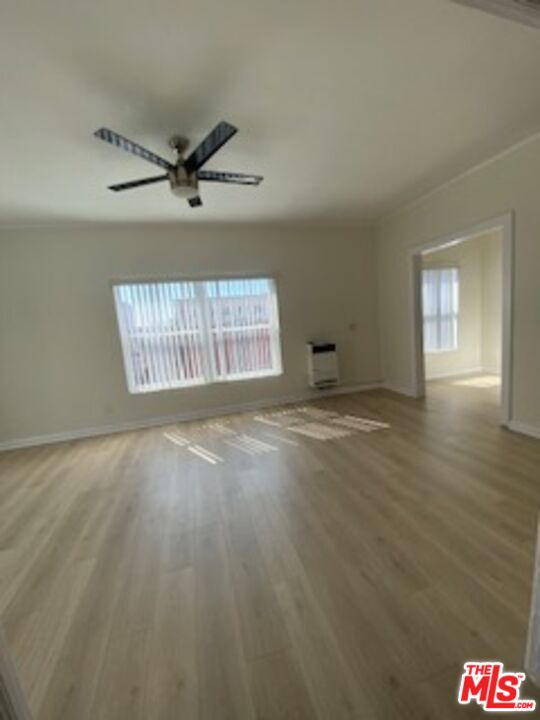 814 South Hobart Boulevard, Unit 410 Los Angeles, CA 90005 - Photo 13 of 22 wooden floor in an empty room with a window