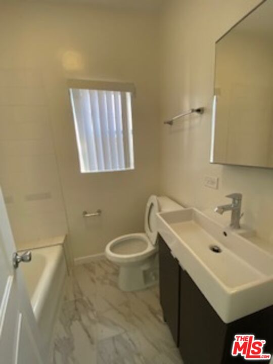 814 South Hobart Boulevard, Unit 410 Los Angeles, CA 90005 - Photo 14 of 22 a bathroom with a sink and a toilet