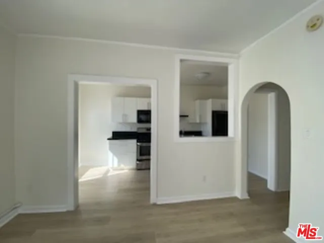 wooden floor in kitchen and a room