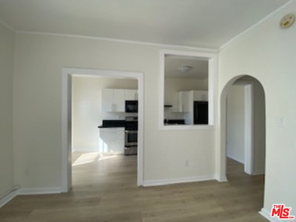 814 South Hobart Boulevard, Unit 410 Los Angeles, CA 90005 - Photo 16 of 22 wooden floor in kitchen and a room