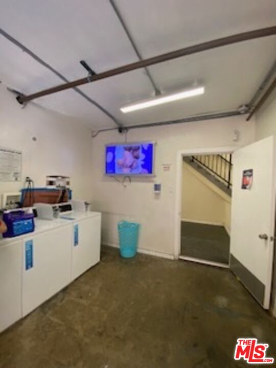 814 South Hobart Boulevard, Unit 410 Los Angeles, CA 90005 - Photo 19 of 22 a storage room with cabinets