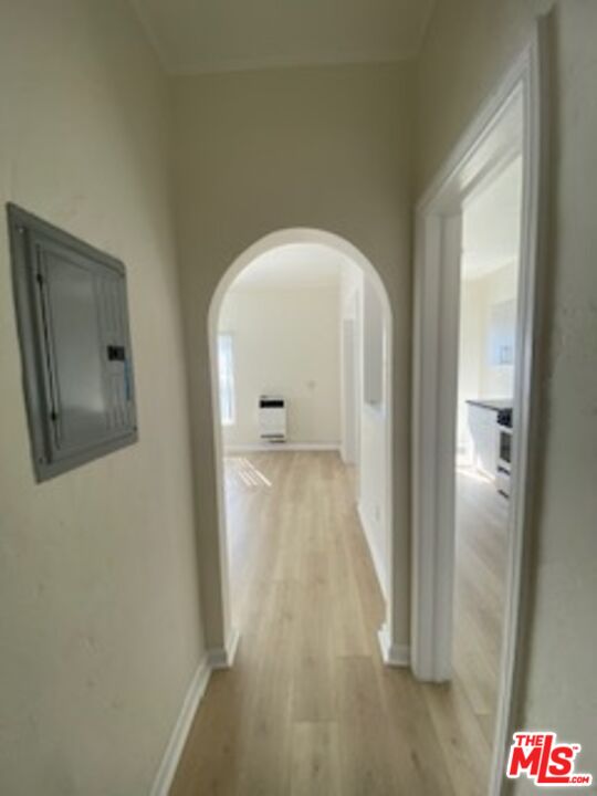 814 South Hobart Boulevard, Unit 410 Los Angeles, CA 90005 - Photo 6 of 22 a view of a hallway with wooden floor