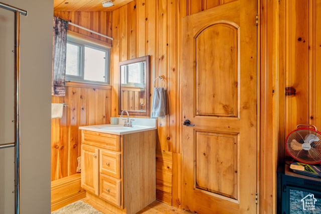 714 Spotted Fawn Way Kamas, UT 84036 - Photo 21 of 34 Bathroom featuring vanity and wooden walls
