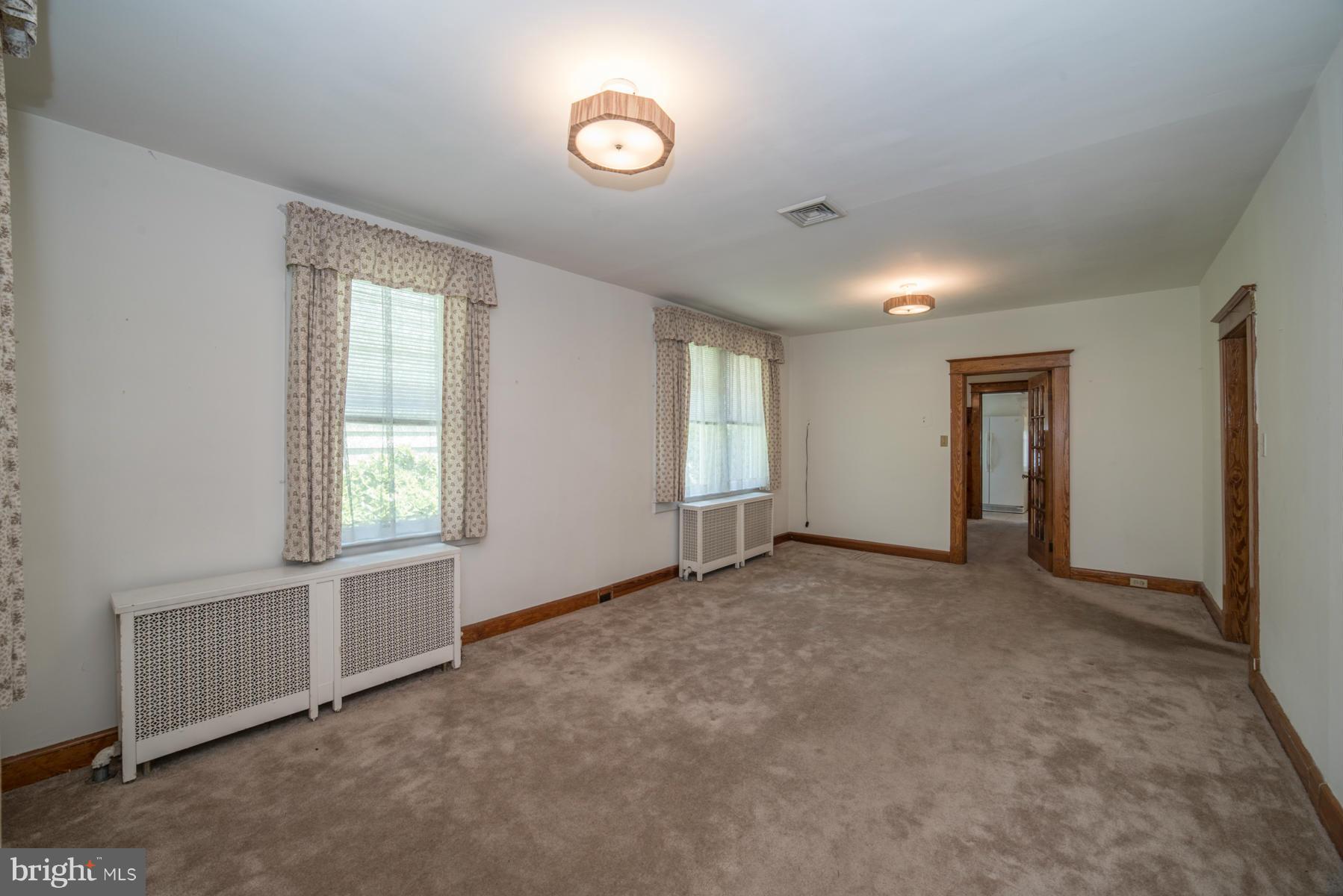 5415 Highview Road Baltimore, MD 21227 - Photo 3 of 25 an empty room with windows