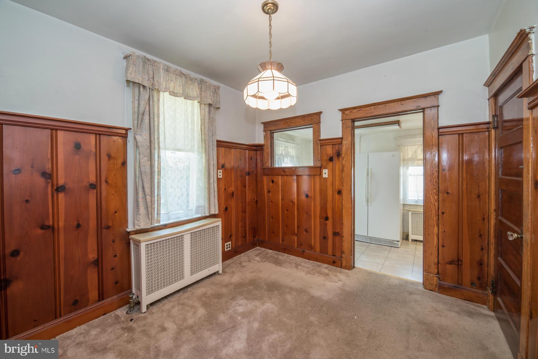 5415 Highview Road Baltimore, MD 21227 - Photo 4 of 25 a view of a hallway with chandelier and door