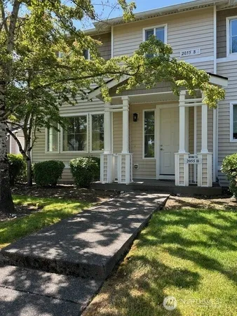 front view of a house with a yard