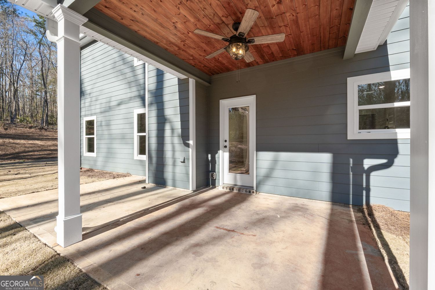 1578 English Road Forsyth, GA 31029 - Photo 34 of 39 a bedroom with a bed and a large window with balcony view