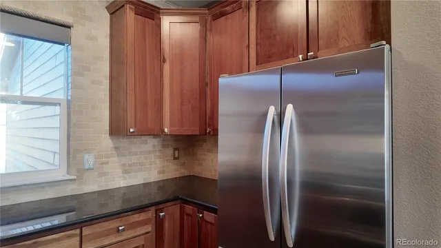 a view of an empty room with a fireplace