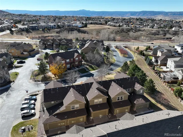 a front view of a house with plants