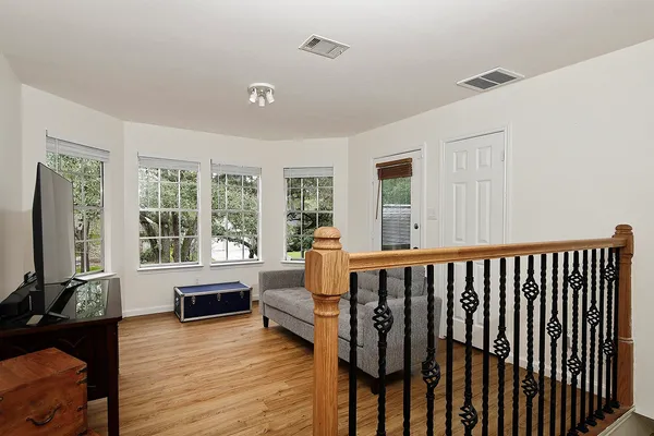 a living room with furniture fireplace and flat screen tv