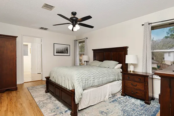 a bedroom with a large bed and a window