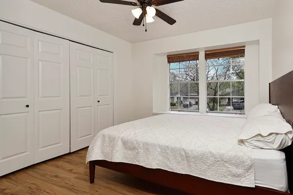 a bedroom with a bed and window