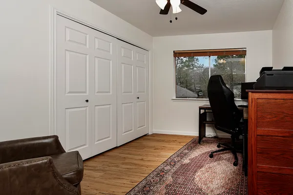 a workspace with furniture hardwood and a window