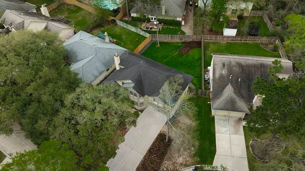 an aerial view of a house with a garden