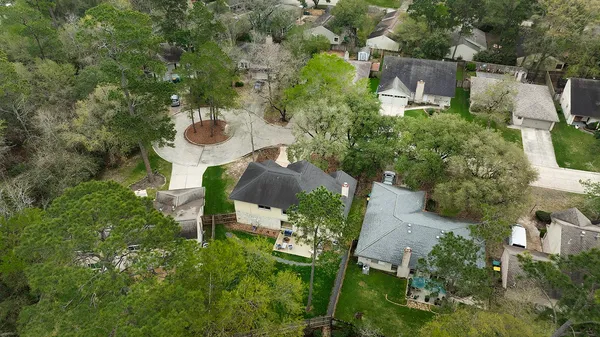 an aerial view of a house with outdoor space