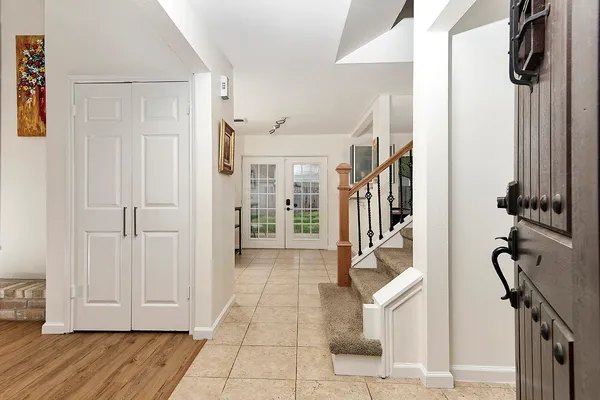 a view of an entryway with wooden floor