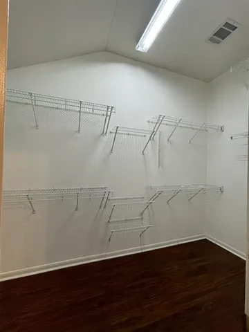 a view of a room with racks on the wall