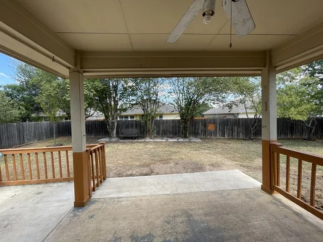 a view of a porch with a backyard