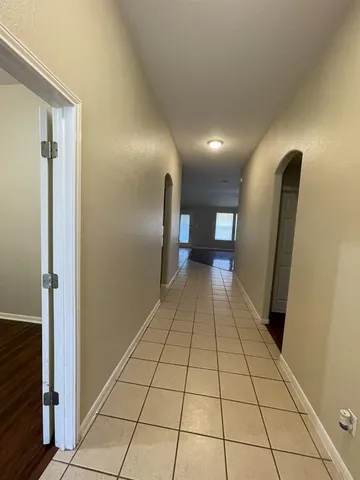 a view of empty room with a fireplace