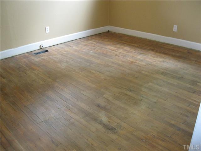 922 Ranch Farm Road Raleigh, NC 27603 - Photo 6 of 12 wooden floor and empty room