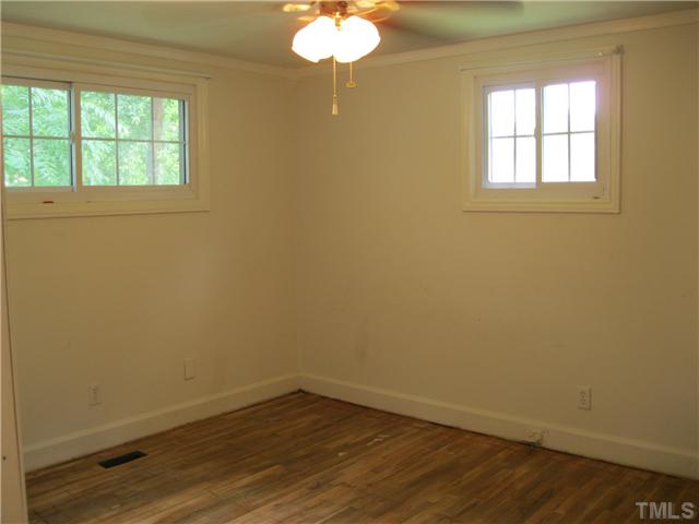 922 Ranch Farm Road Raleigh, NC 27603 - Photo 8 of 12 an empty room with a window