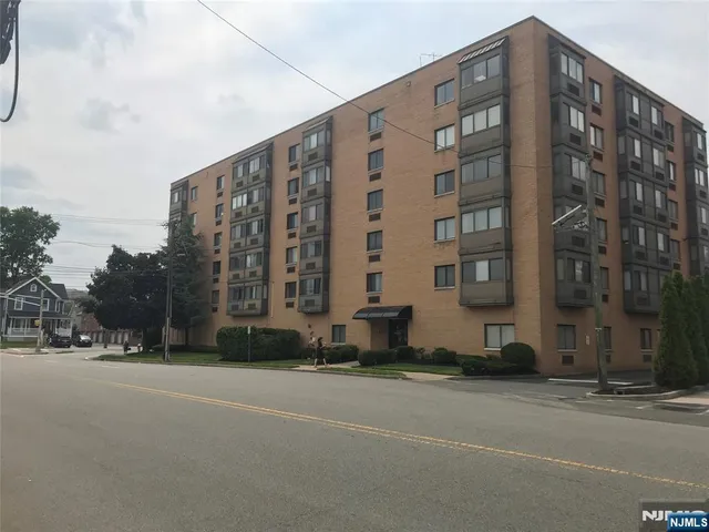 a tall building sitting on the side of a street