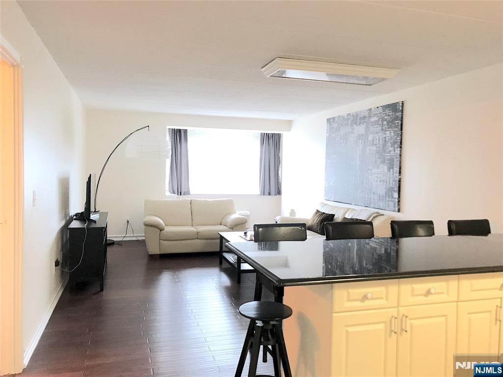 5 Linden Street, Unit 3C Hackensack, NJ 07601 - Photo 18 of 29 a living room with furniture and a large window