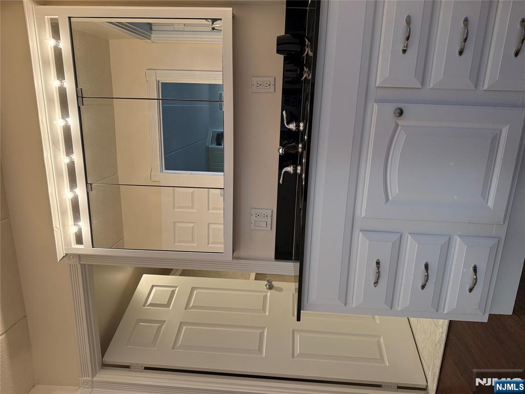 5 Linden Street, Unit 3C Hackensack, NJ 07601 - Photo 21 of 29 a kitchen with a white cabinets and a stove