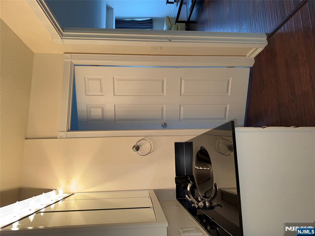 5 Linden Street, Unit 3C Hackensack, NJ 07601 - Photo 23 of 29 a kitchen with a refrigerator stove and wooden floor