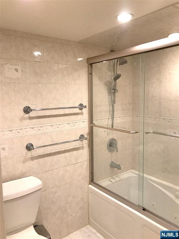 5 Linden Street, Unit 3C Hackensack, NJ 07601 - Photo 25 of 29 a bathroom with a shower a toilet and a sink