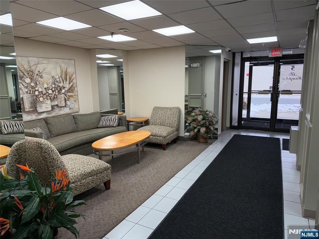 5 Linden Street, Unit 3C Hackensack, NJ 07601 - Photo 7 of 29 a living room with furniture and a large window